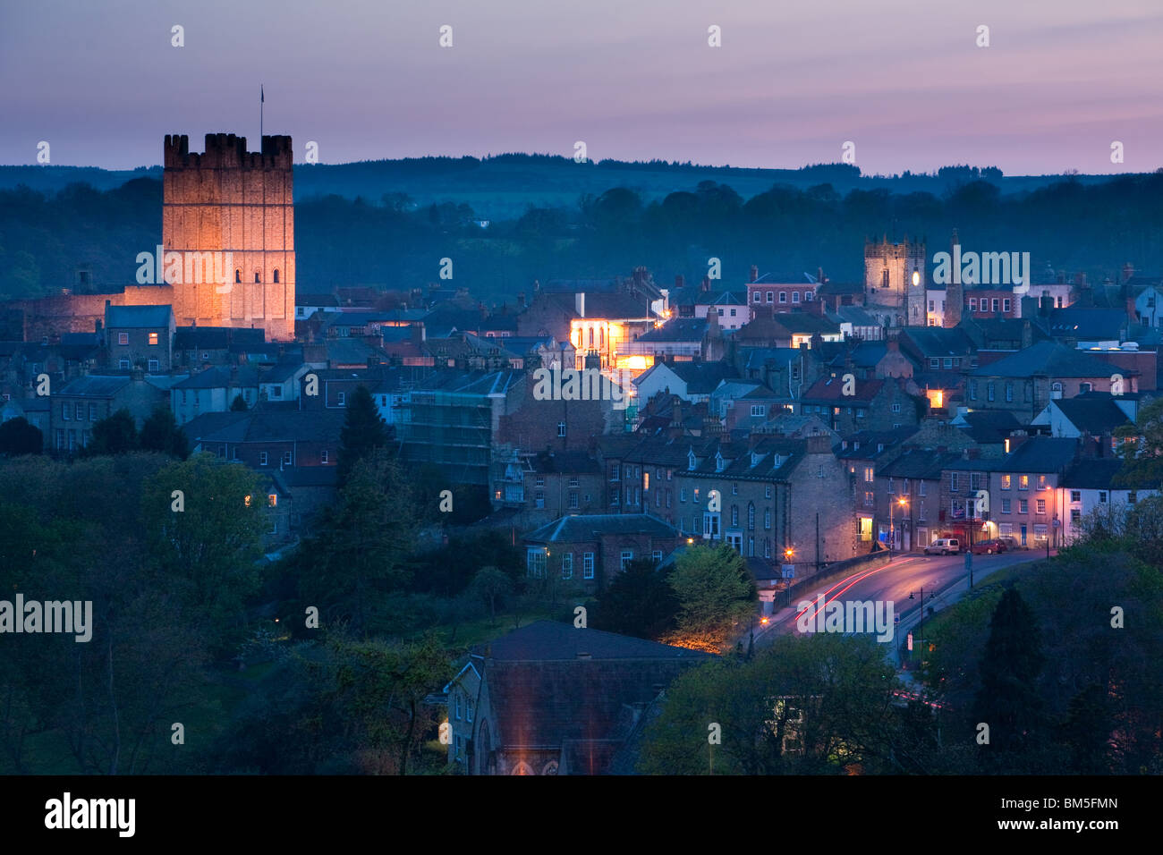 Dusk in historic Richmond showing the floodlit castle North Yorkshire, England Stock Photo