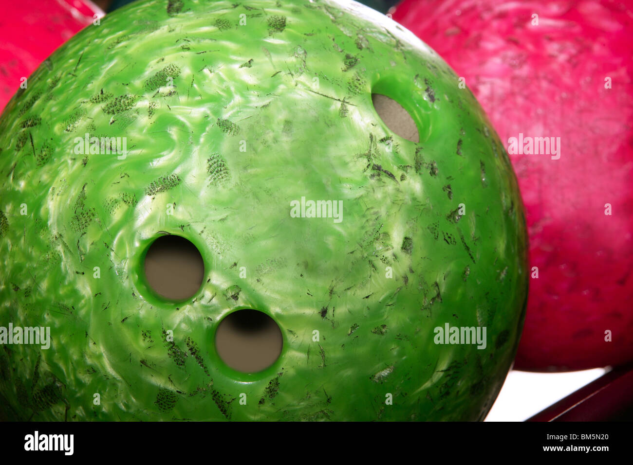 Bowling balls red green closeup row detail Stock Photo - Alamy