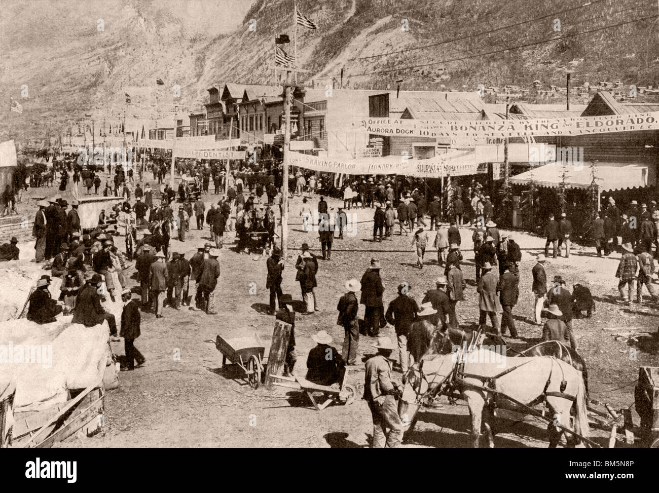Miners and new settlers crowding Dawson City during the Klondyke Gold Rush, 1900. Halftone of a photograph Stock Photo