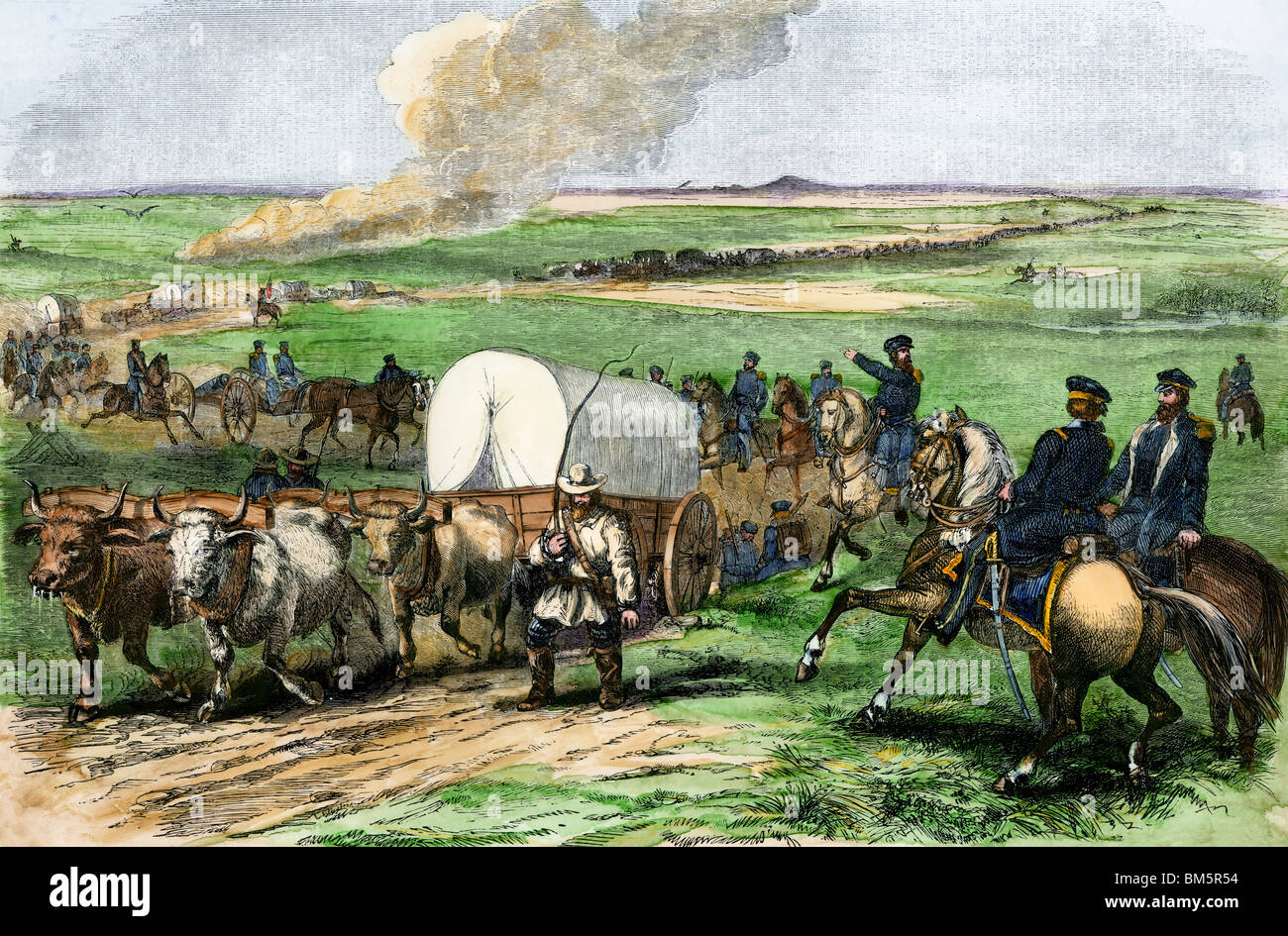 Supply wagons and US troops crossing the Great Plains, 1850s. Hand-colored woodcut Stock Photo