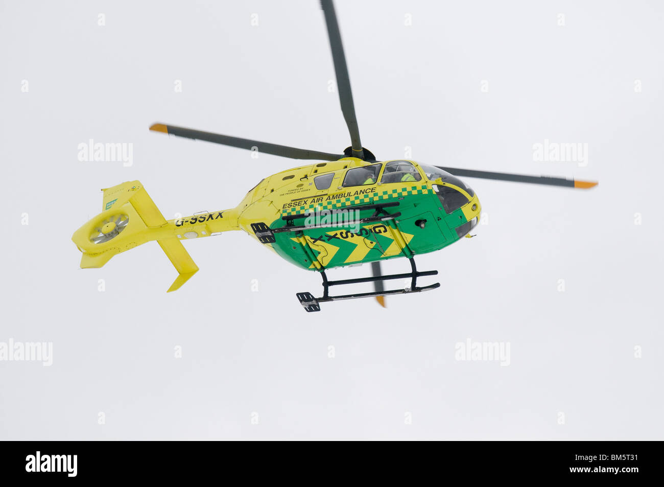 Essex Air Ambulance in flight over Kelvedon, Essex. Stock Photo