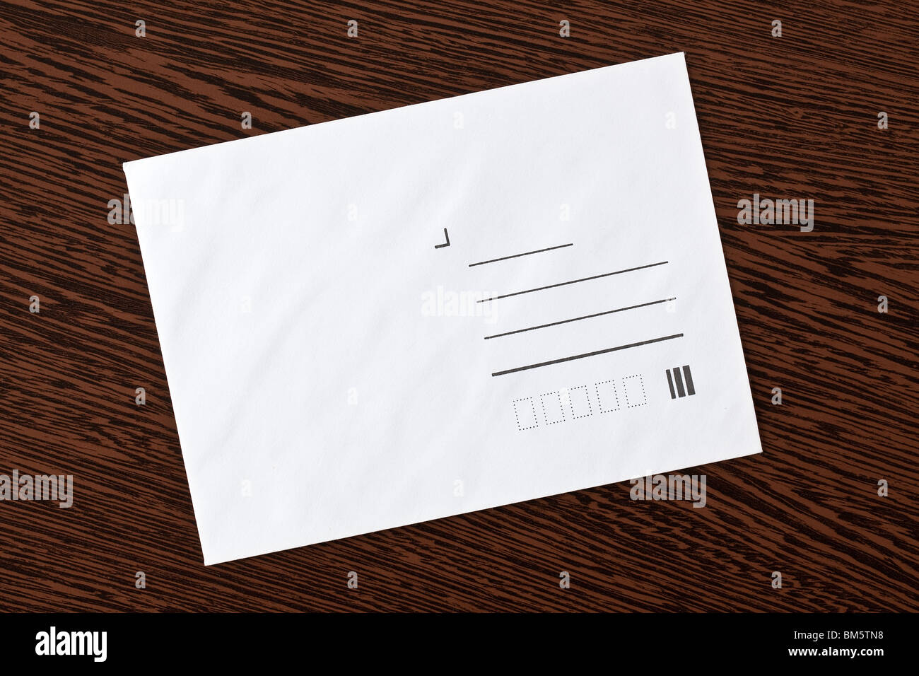 white envelope on wooden background Stock Photo