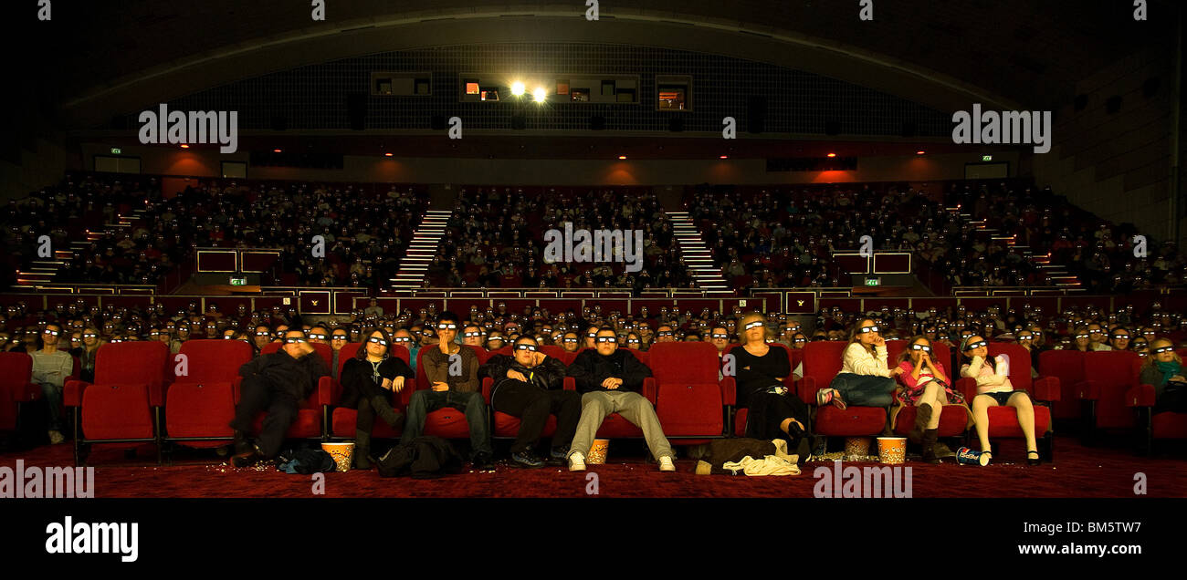 Large audience wearing 3D glasses watching a move Stock Photo