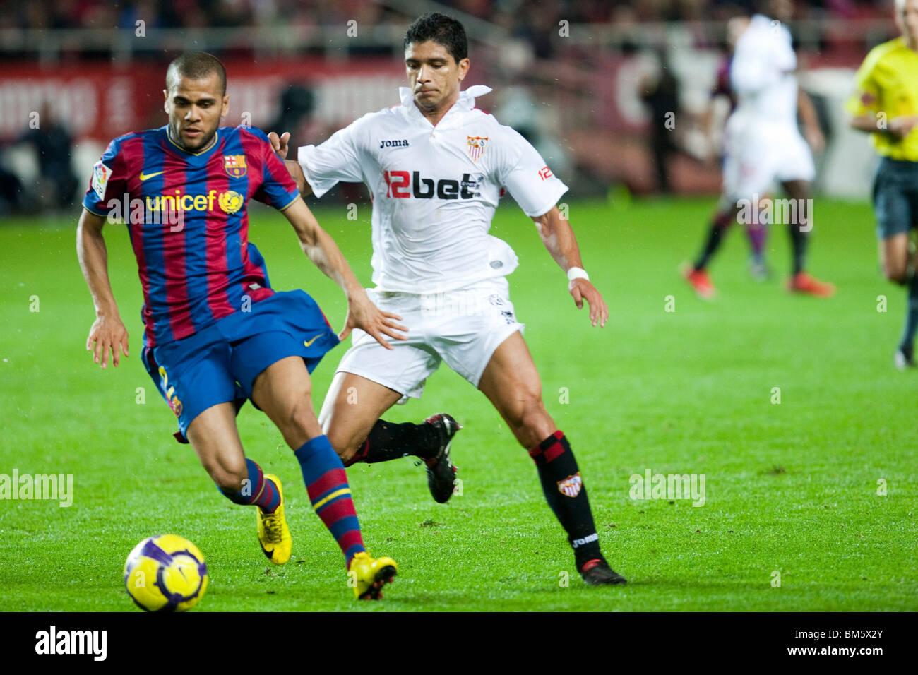 Daniel Alves with the ball pursued by Renato. Stock Photo