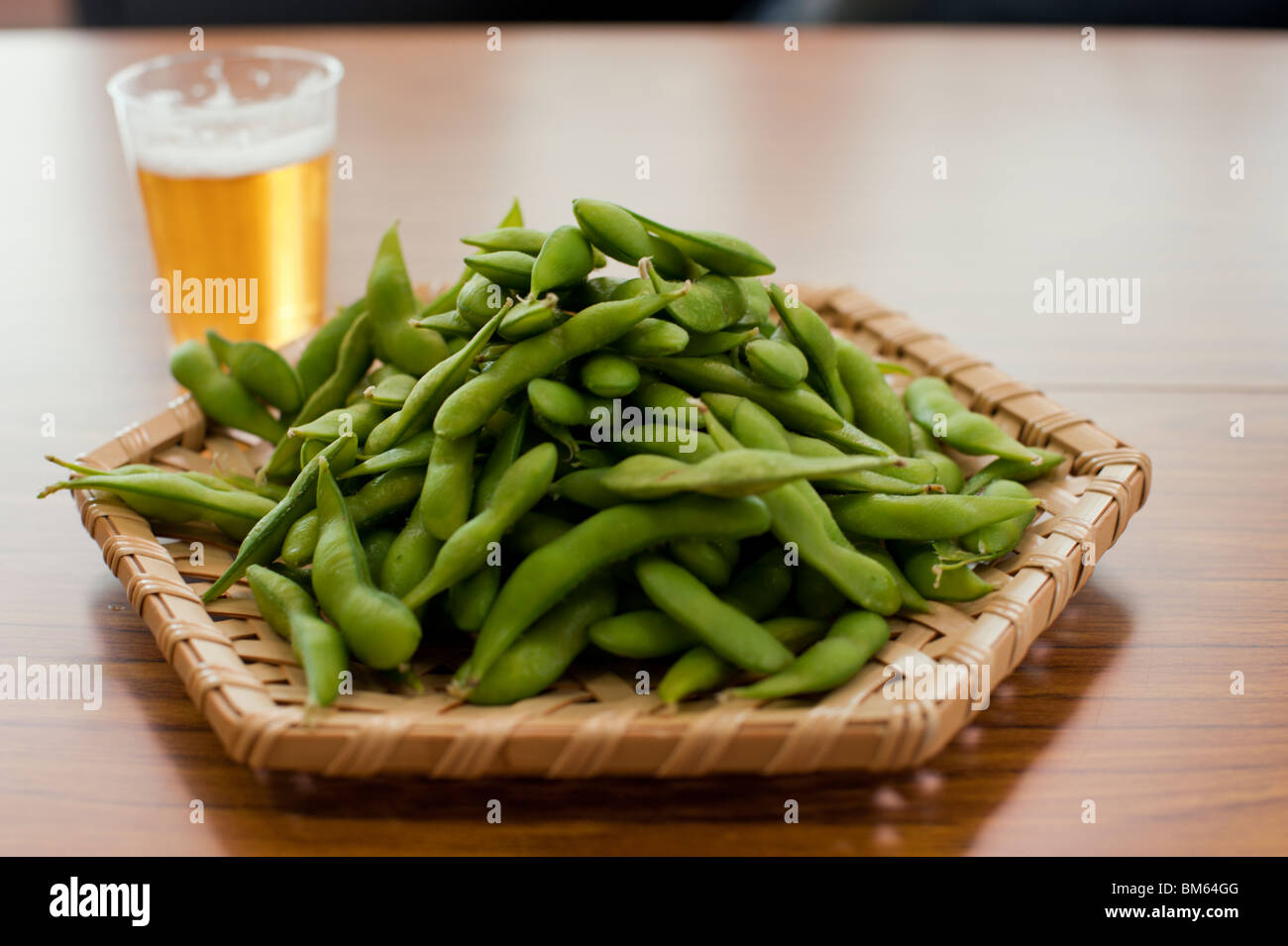 Steamed edamame (Japanese green soy beans) served in a bamboo basket