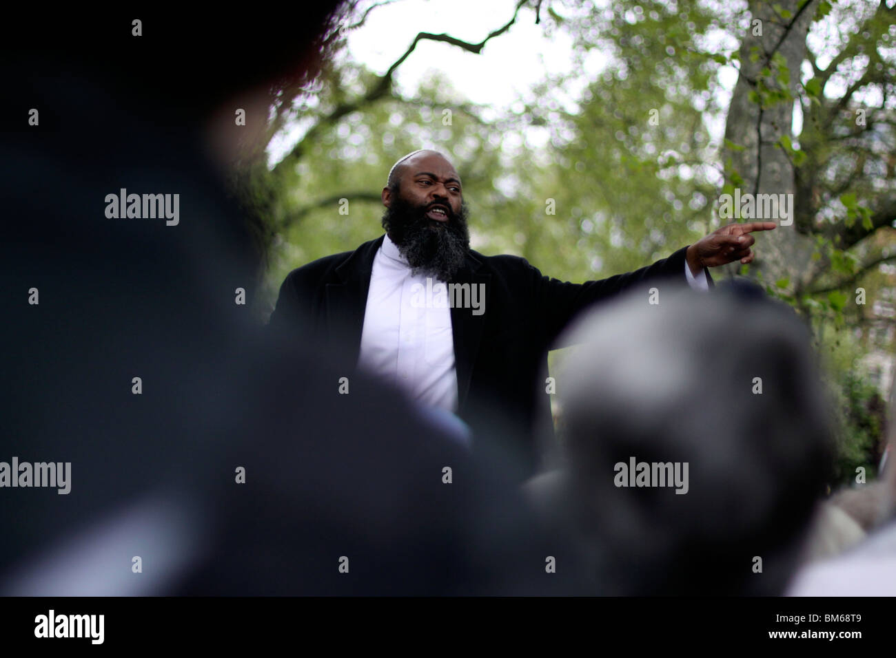 Muslim man addressing a crowd at Speakers' Corner in Hyde Park, London