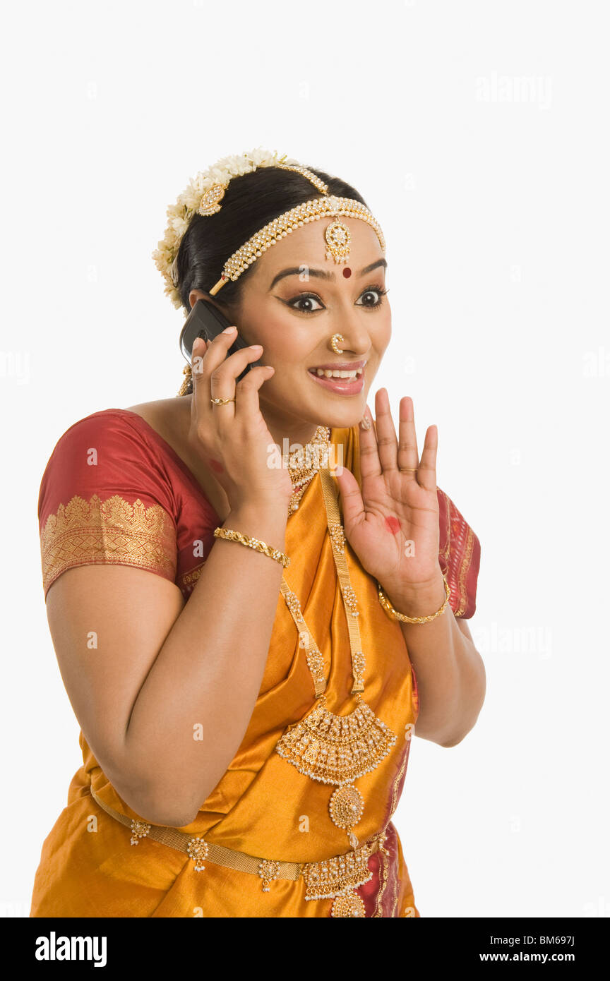 South Indian woman talking on a mobile phone Stock Photo - Alamy