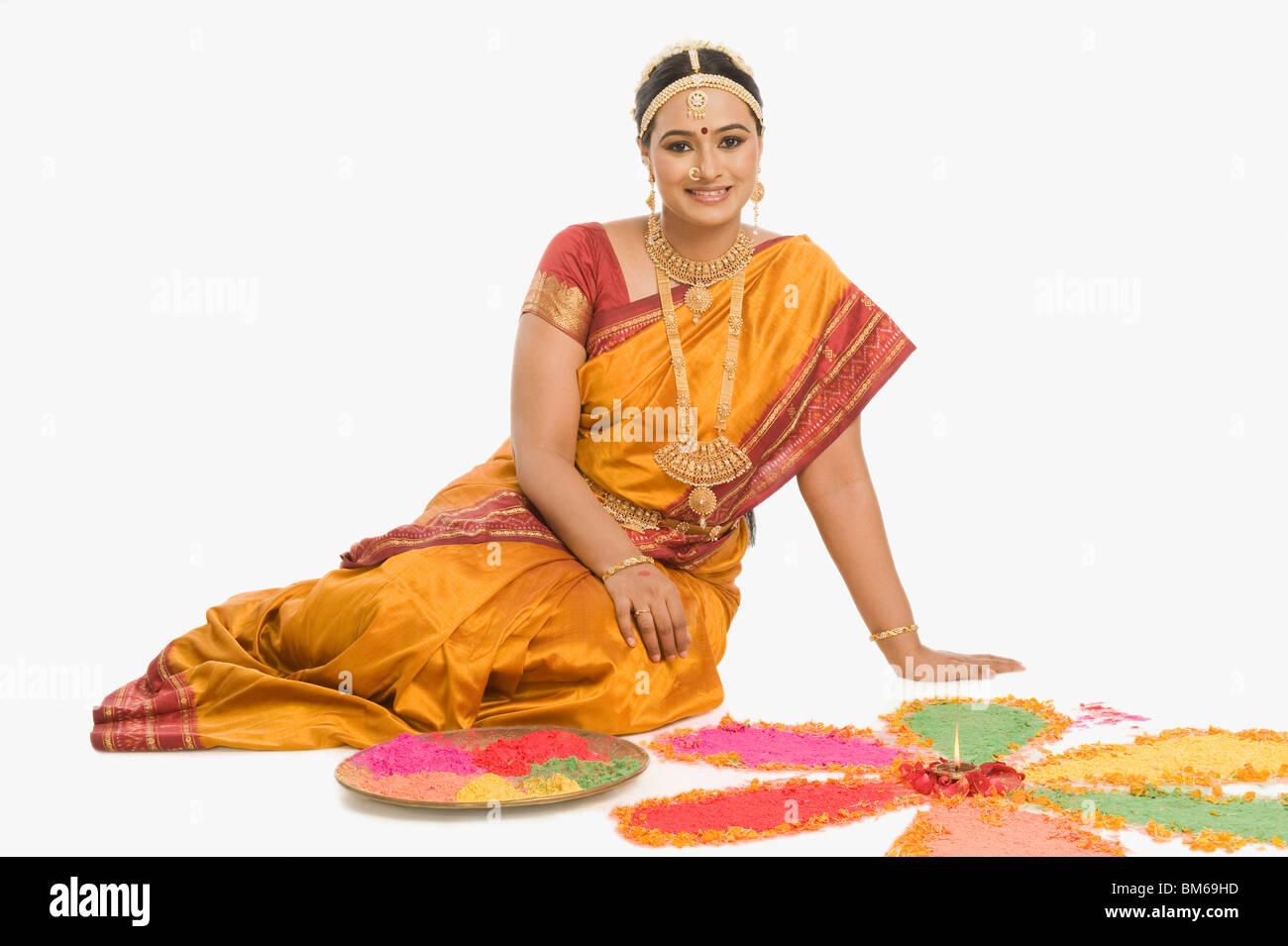 South Indian woman making rangoli Stock Photo - Alamy