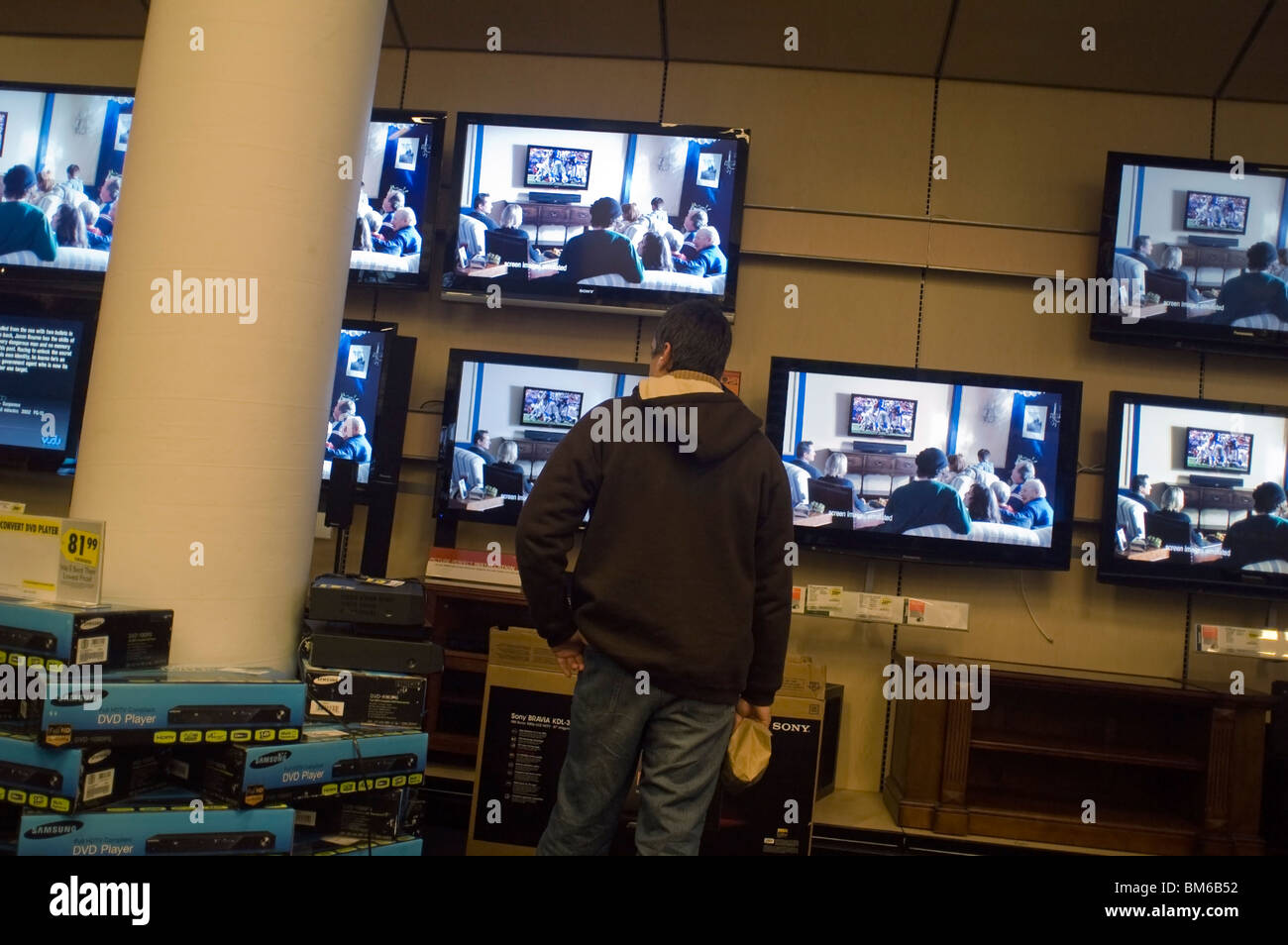 Customers browse the flat screen television display at a Best Buy electronics store in New York Stock Photo