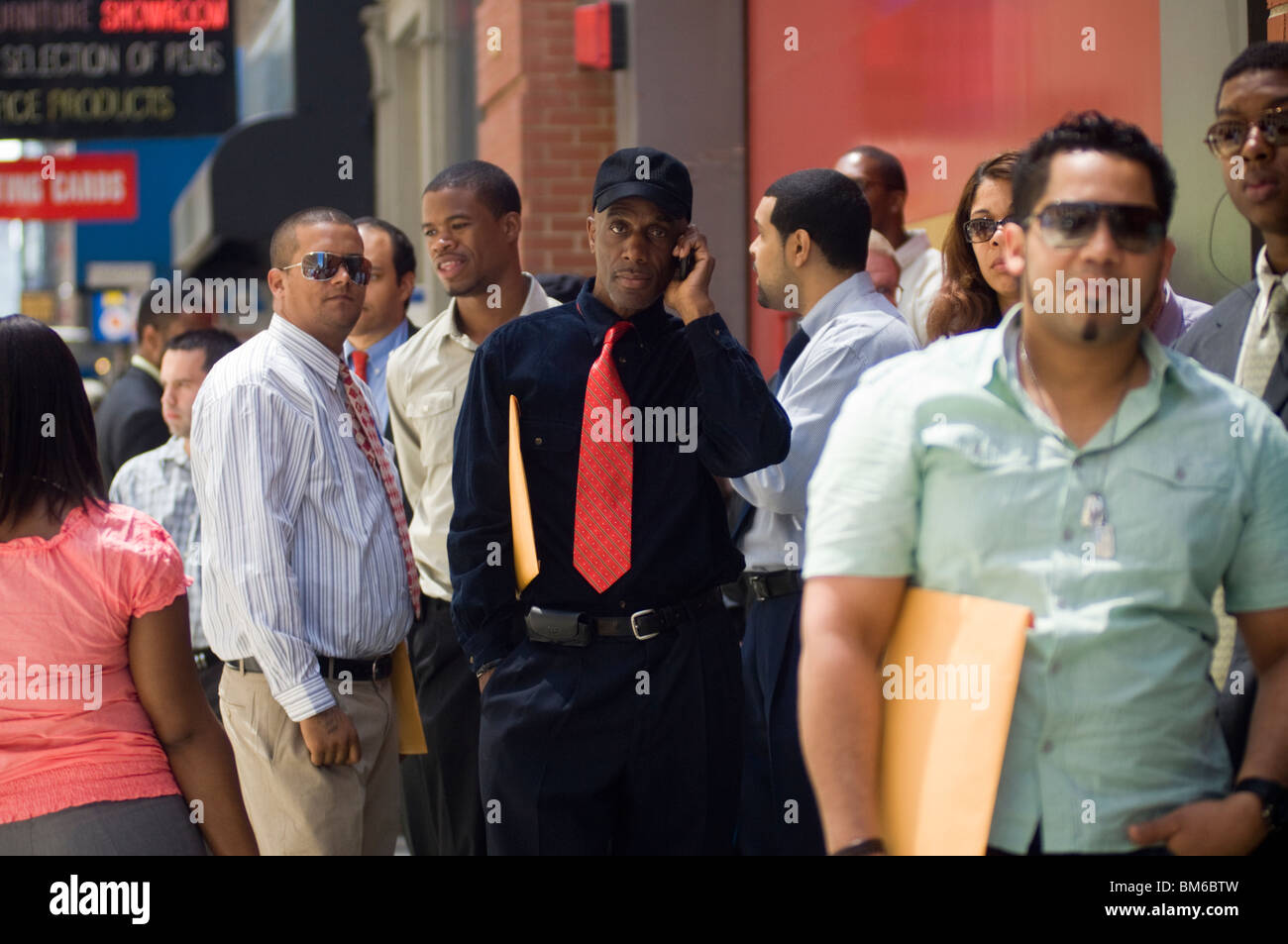 Job seekers line up for a job fair in midtown in New York Stock Photo