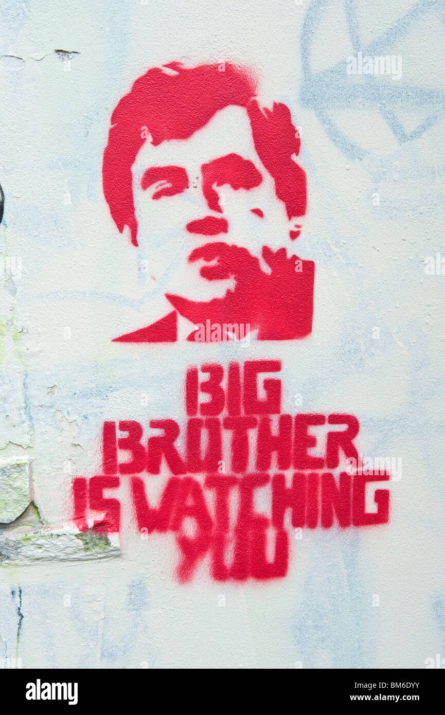 BIG BROTHER IS WATCHING YOU graffiti featuring Gordon Brown on white wall in Cardiff South Wales UK Stock Photo