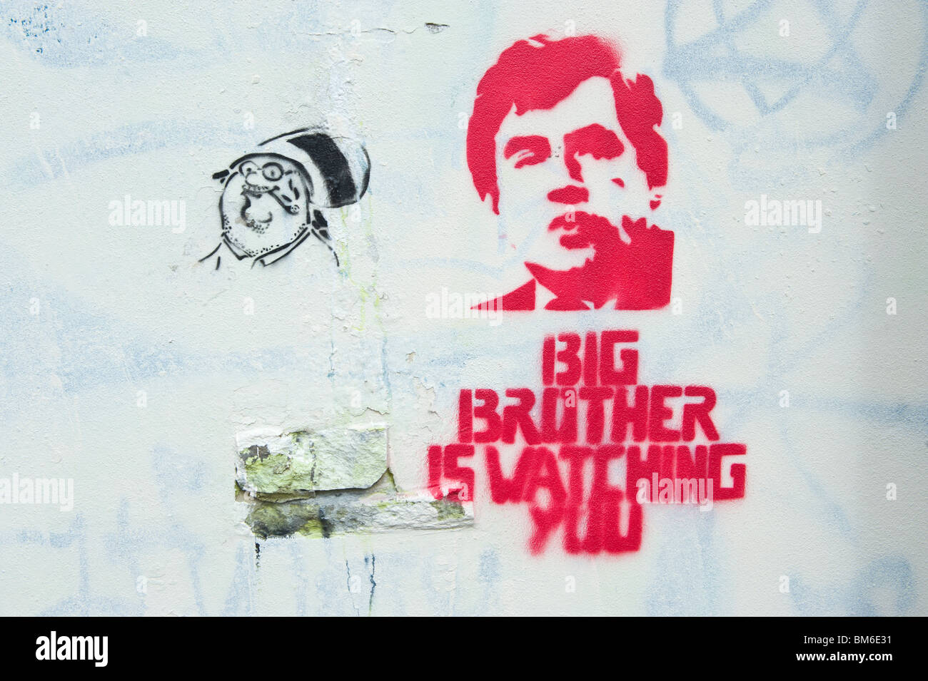 BIG BROTHER IS WATCHING YOU graffiti featuring Gordon Brown on white wall in Cardiff South Wales UK Stock Photo