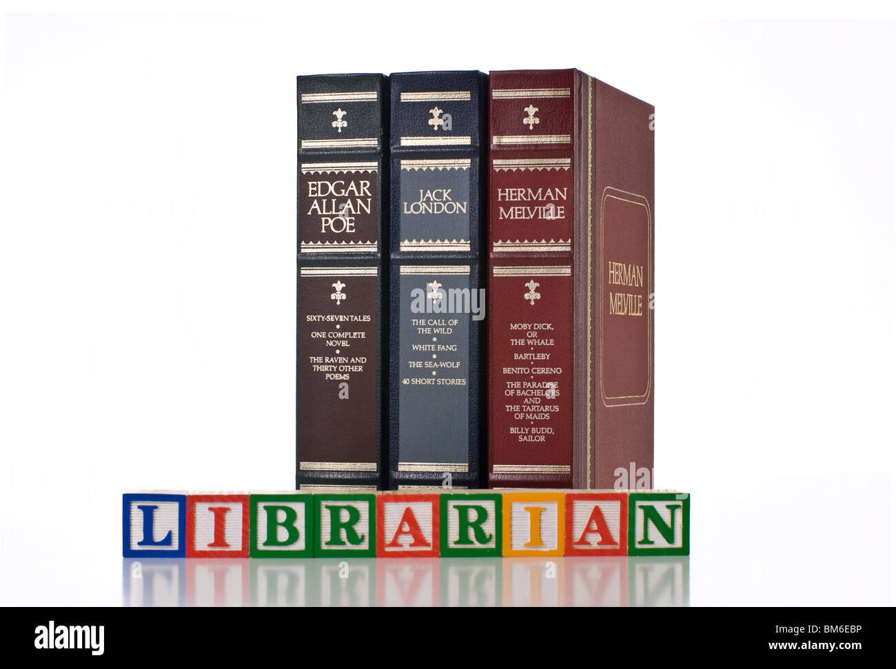 LIBRARIAN spelled using children's wooden blocks with books behind Stock Photo