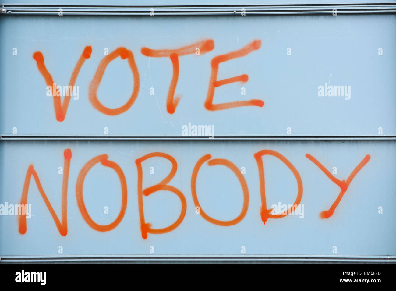 VOTE NOBODY graffiti on rear of roadsign in Cardiff South Wales UK Stock Photo