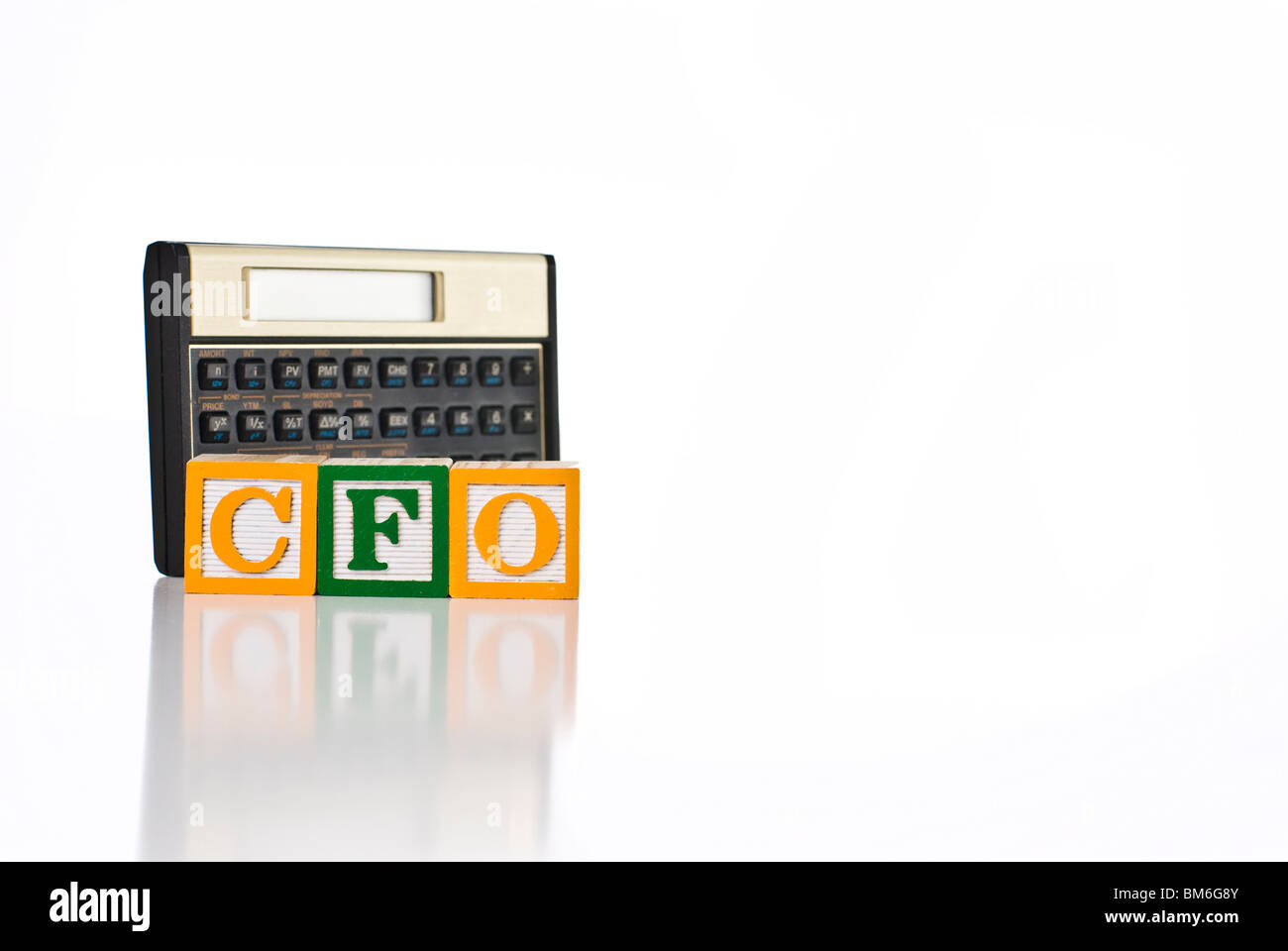 Colorful children's blocks spelling CFO with financial calculator Stock Photo