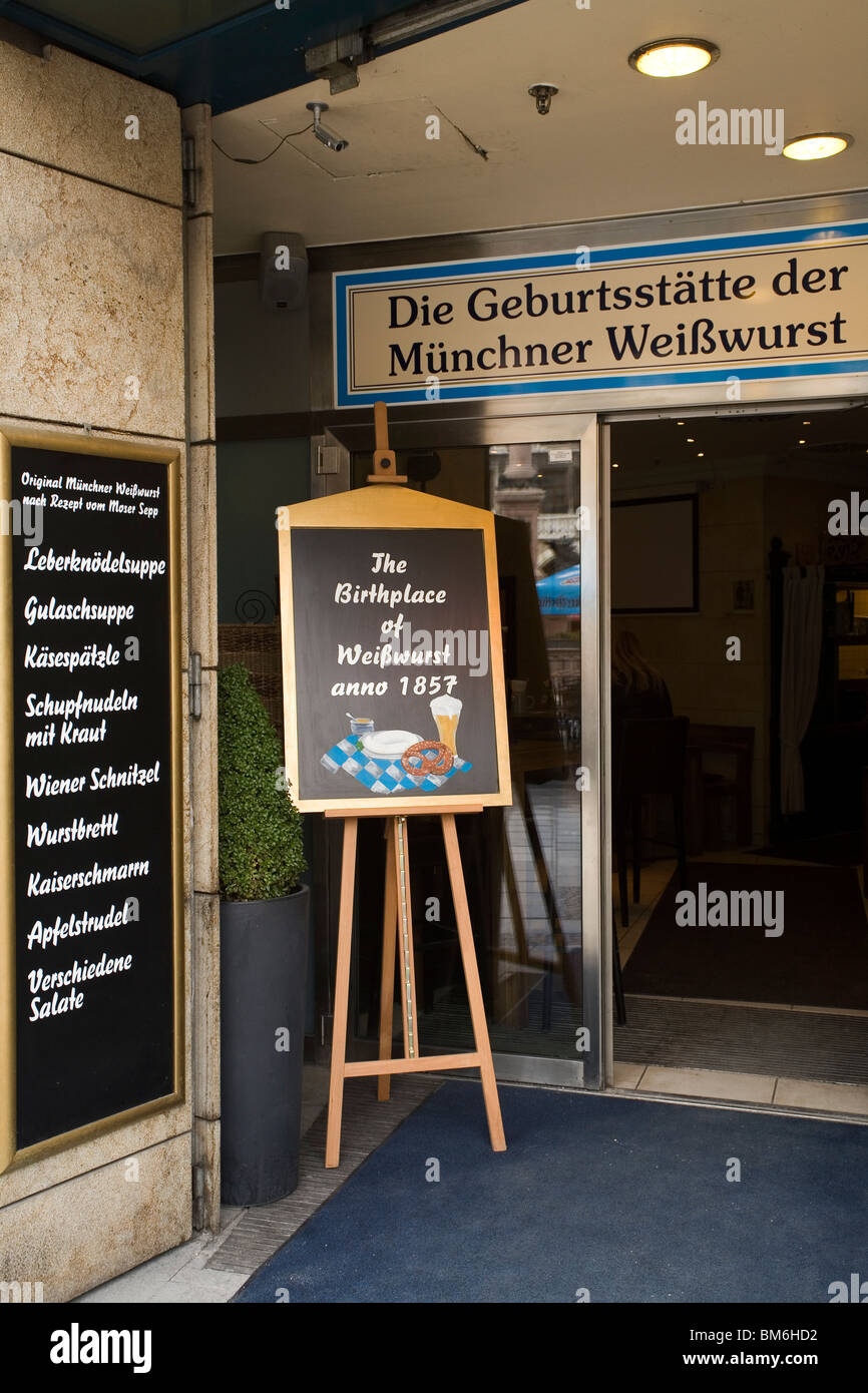 A restaurant on Marienplatz advertises that is the birthplace of the White Sausage (Muencher Weisswurst) in Munich, Germany. Stock Photo