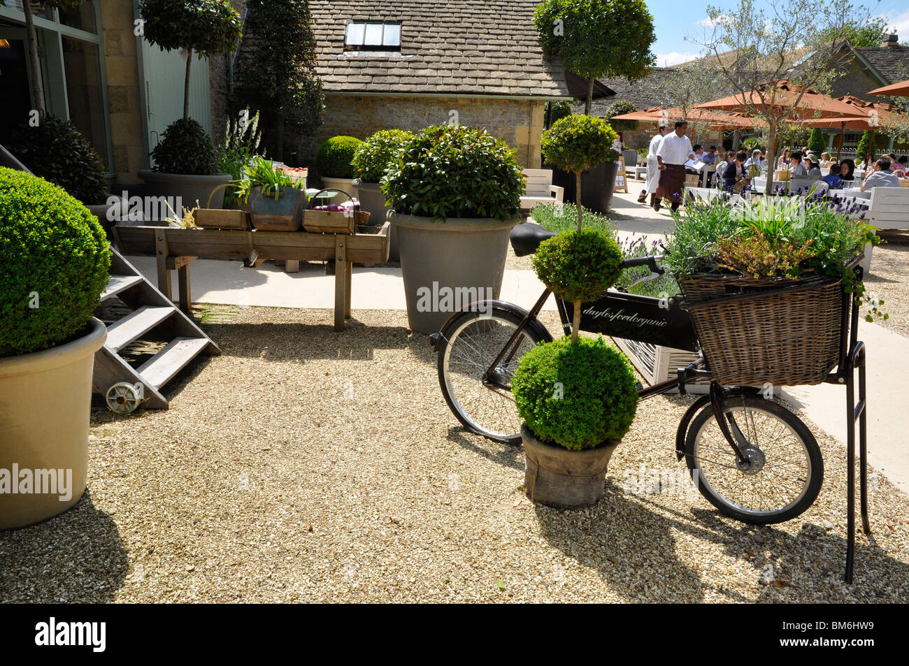 Daylesford Farm Shop with outdoor cafe on a sunny day - Cotswolds, Gloucestershire, UK Stock Photo