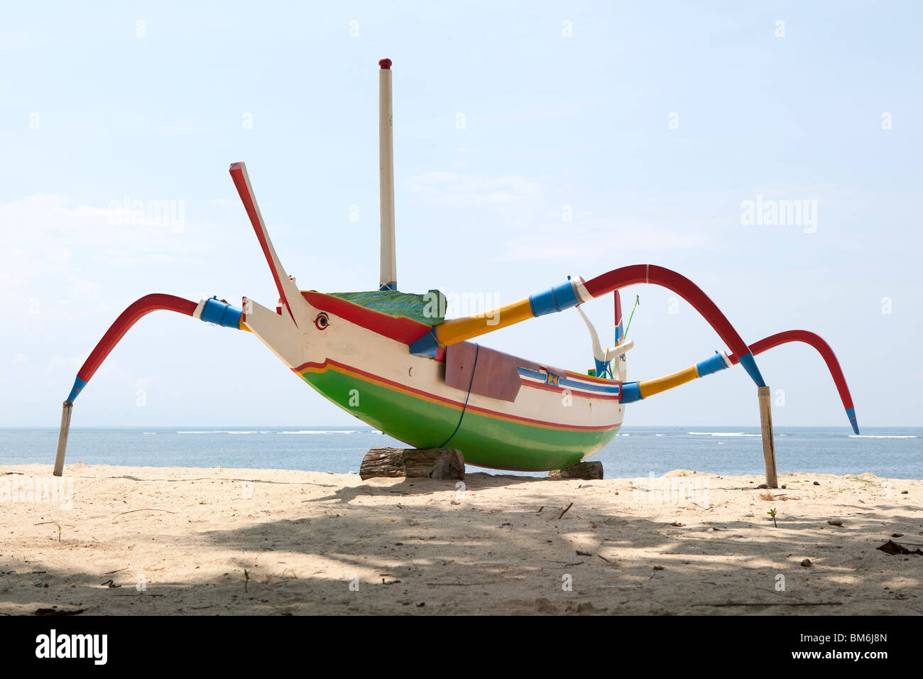 Traditional outrigger fishing boat in Sanur, Bali, Indonesia Stock Photo