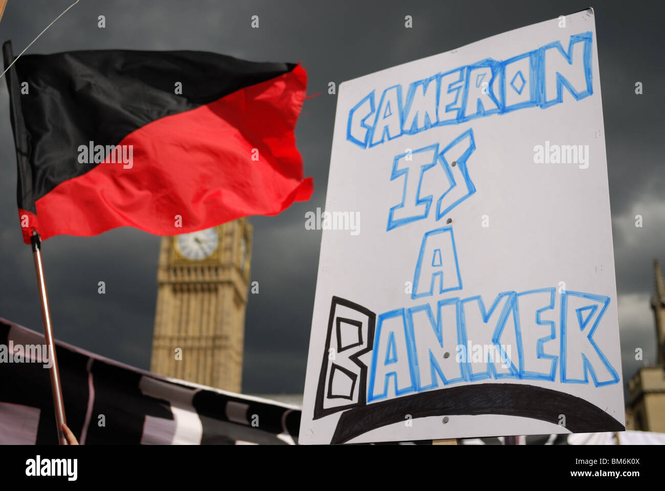 'Cameron is a Banker' placard during the May Day Meltdown demonstration in Parliament Square. Stock Photo