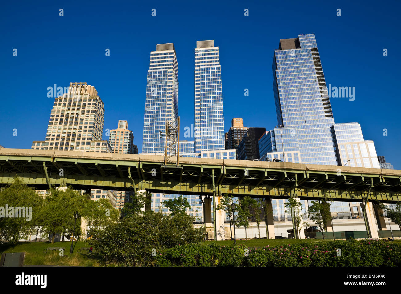 Manhattan skyscrapers form the backdrop to the West Side Highway and the Hudson River Greenway. Stock Photo