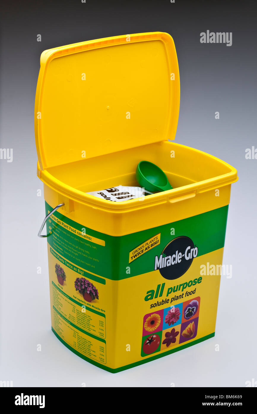 Yellow flip top lid container of Miracle Gro all purpose soluble plant