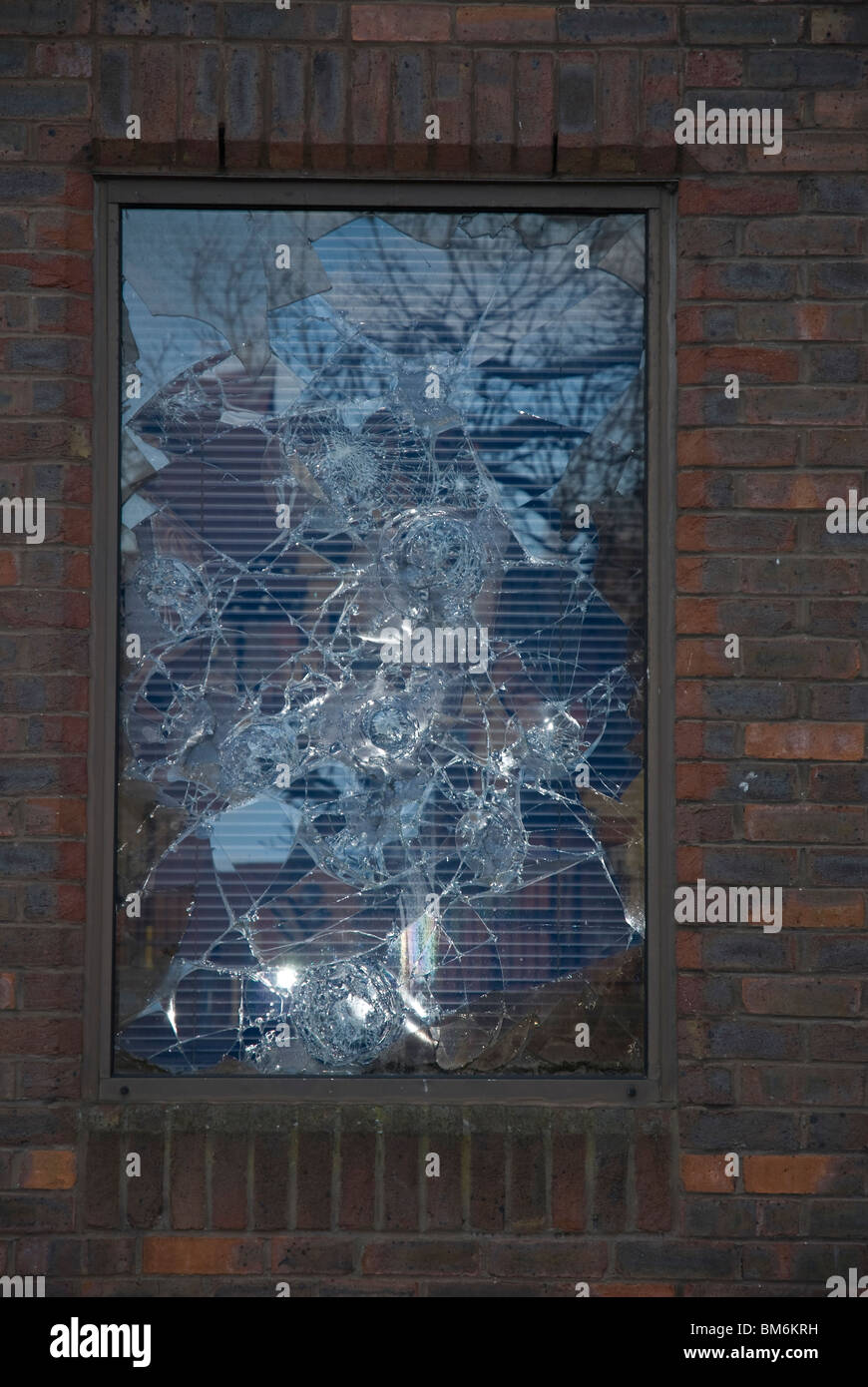 Broken window in a disused building Isleworth, West London England UK Stock Photo