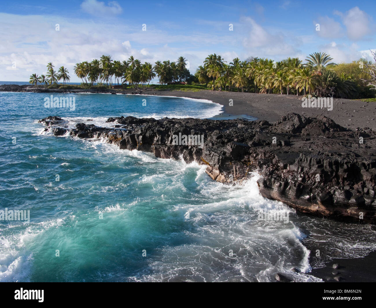 Honomalino Beach in South Kona is a remote black sand beach on Hawaii Island Stock Photo