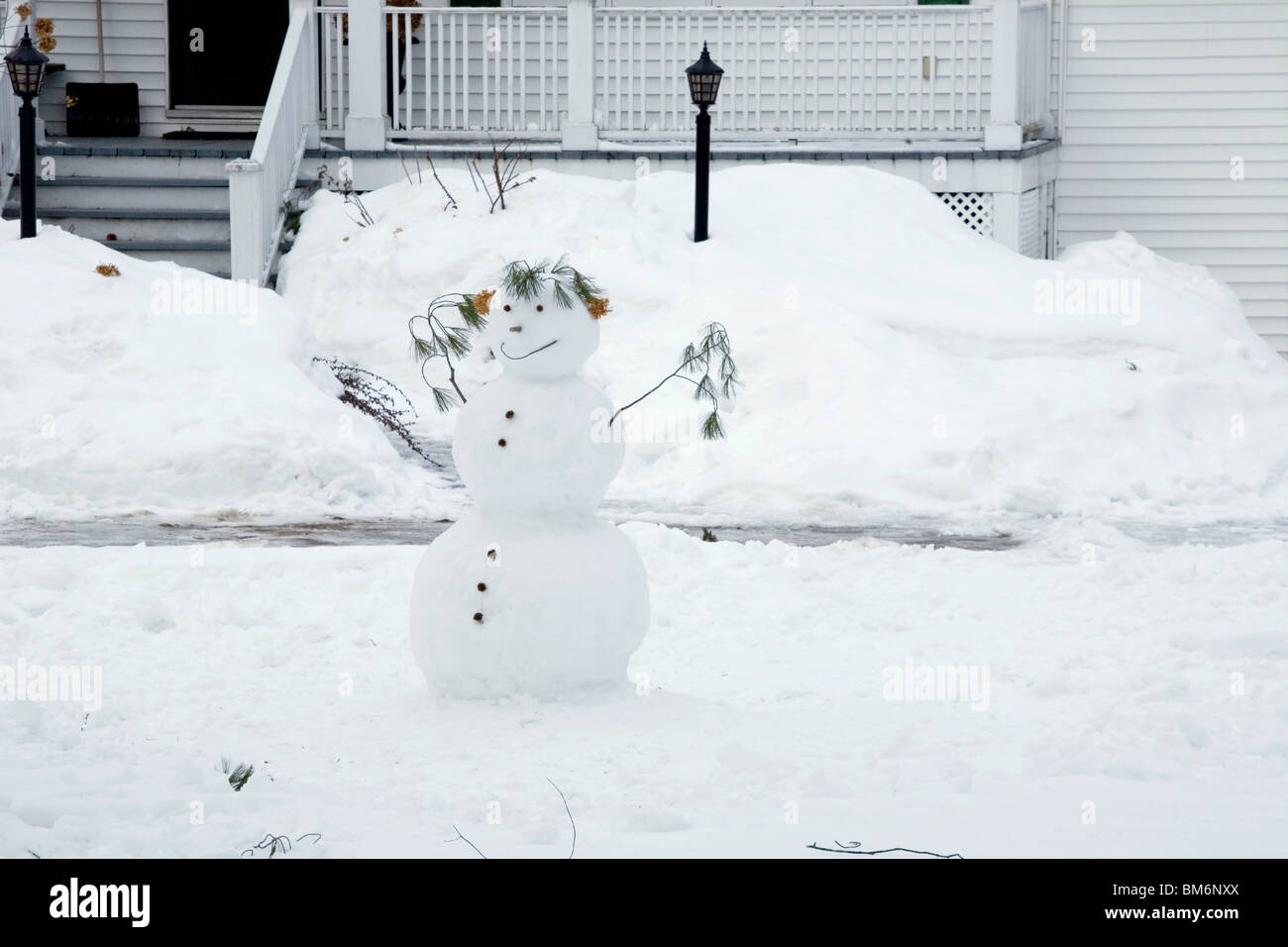 Snowman In A Front Yard Stock Photo Alamy