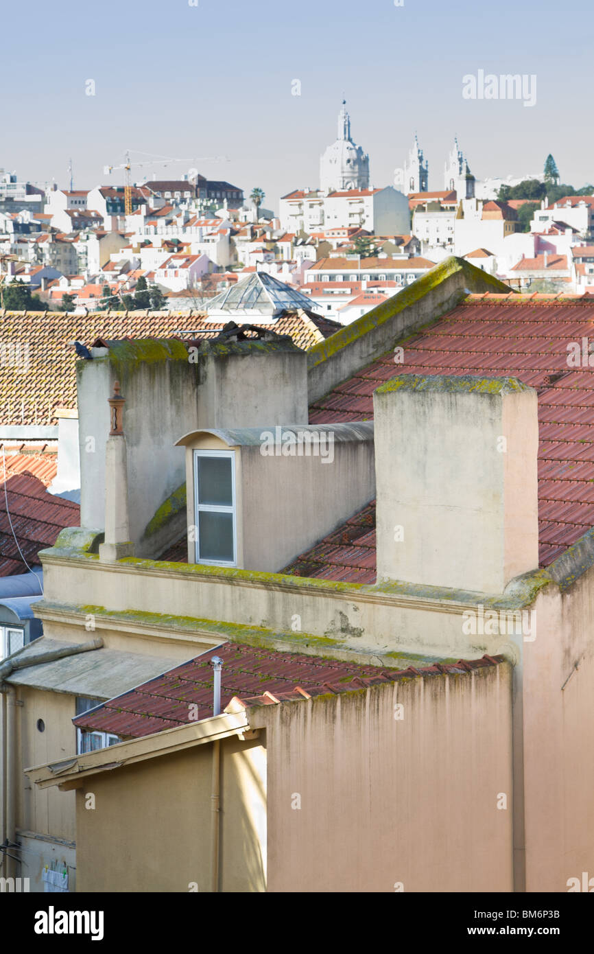 A closeup of an old rooftop, with rooftops of Lisbon in the distance. Lisbon, Portugal. Stock Photo
