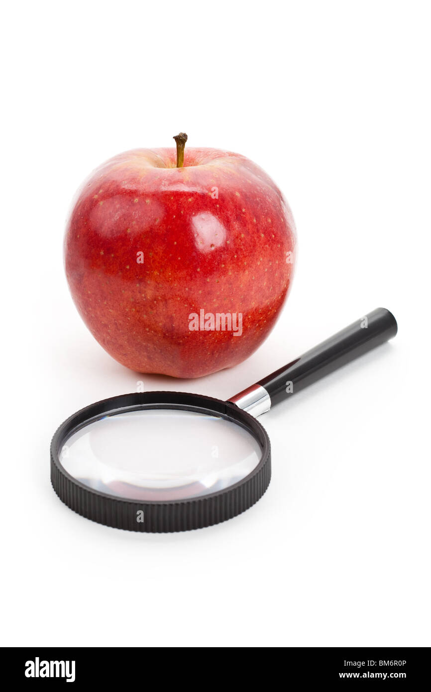 Red apple and Magnifier with white background Stock Photo