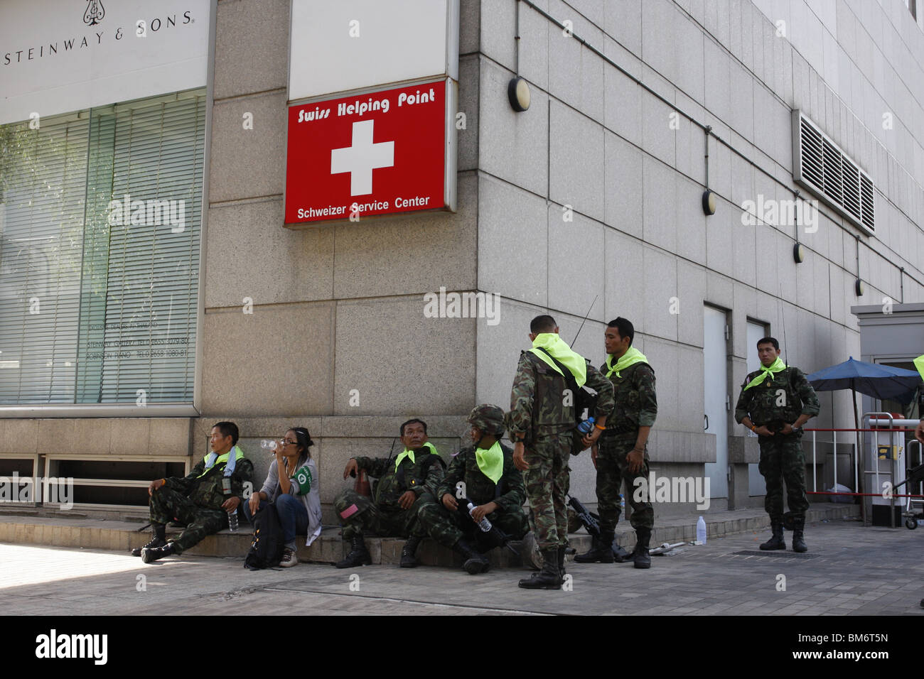 On May 19th, Thai soldiers rest in Chit Lom during a military assault on Red Shirt demonstrators Stock Photo