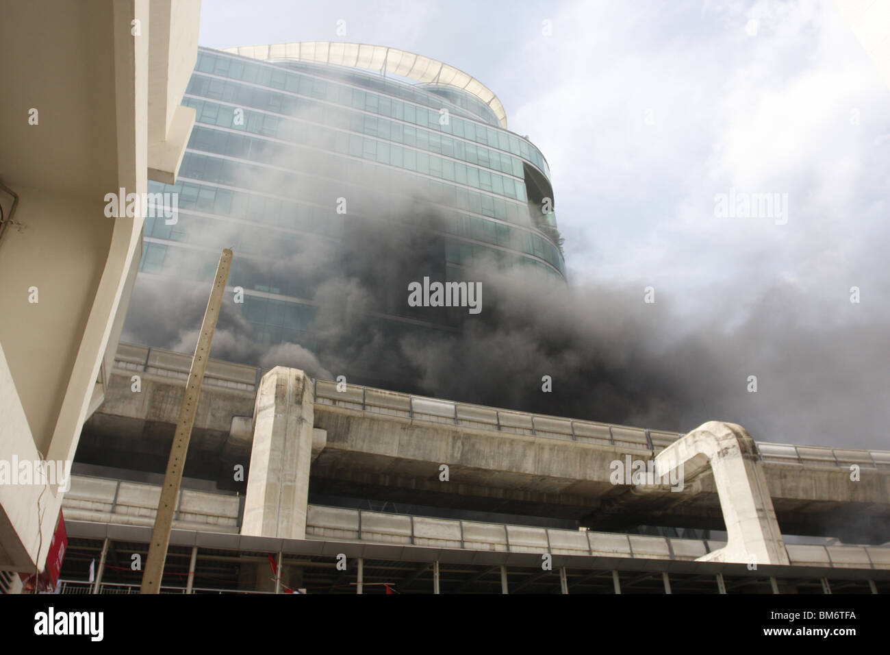 On May 19th, Red Shirt demonstrators, an anti government movement in Thailand, set fire to Central World department store. Stock Photo
