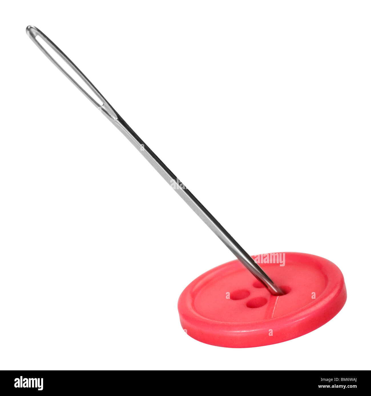 Closeup of a needle in the button hole Stock Photo Alamy