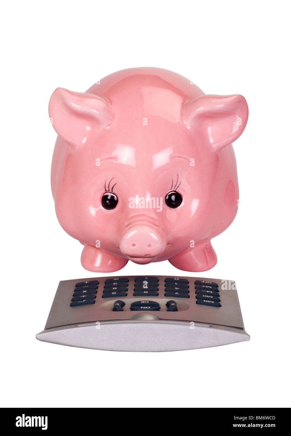 Close-up of a piggy bank with a calculator Stock Photo - Alamy