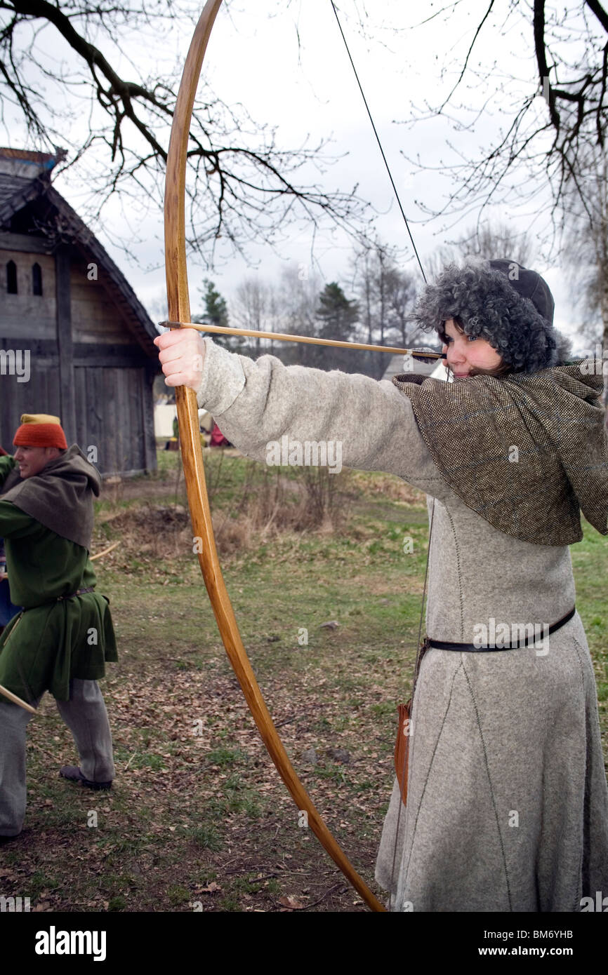 Viking reenactment. Young medieval female archer. Ale Viking Village, Sweden Stock Photo