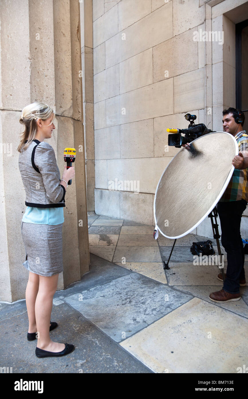 news reporter and her cameraman news reporter and her cameraman
