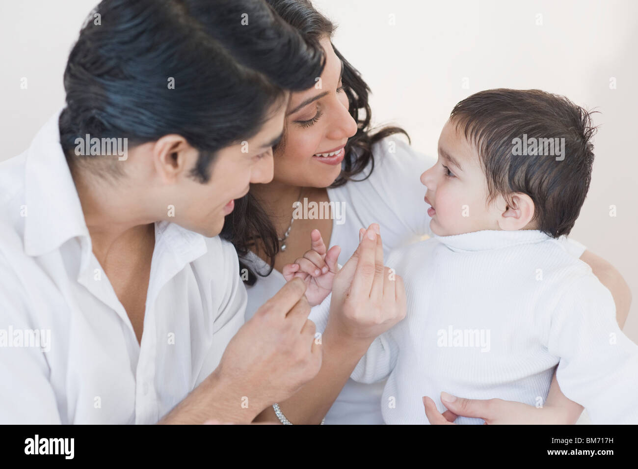 Parents playing with their son Stock Photo