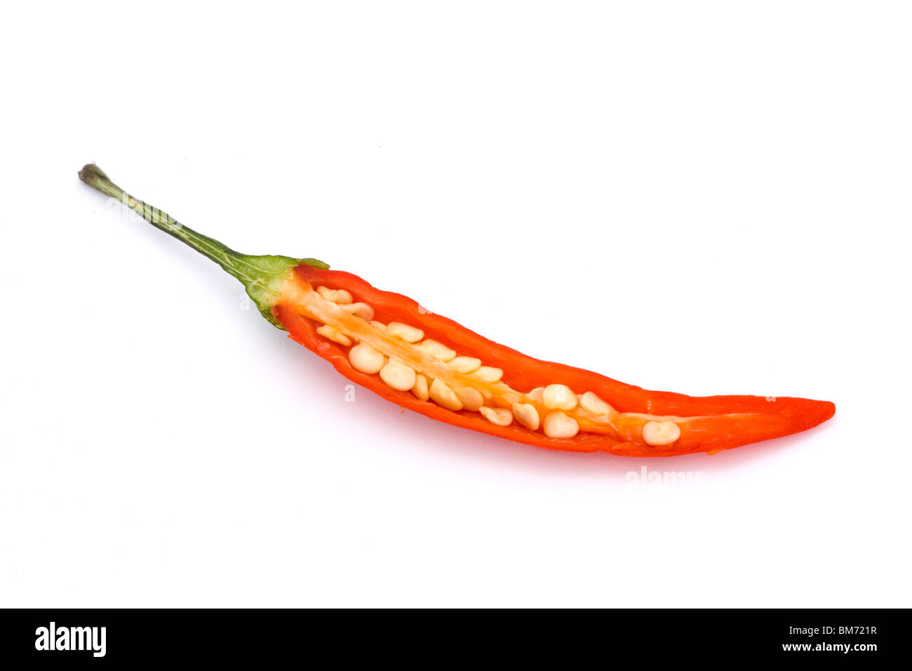 cut open red birds eye chilli on a white background Stock Photo