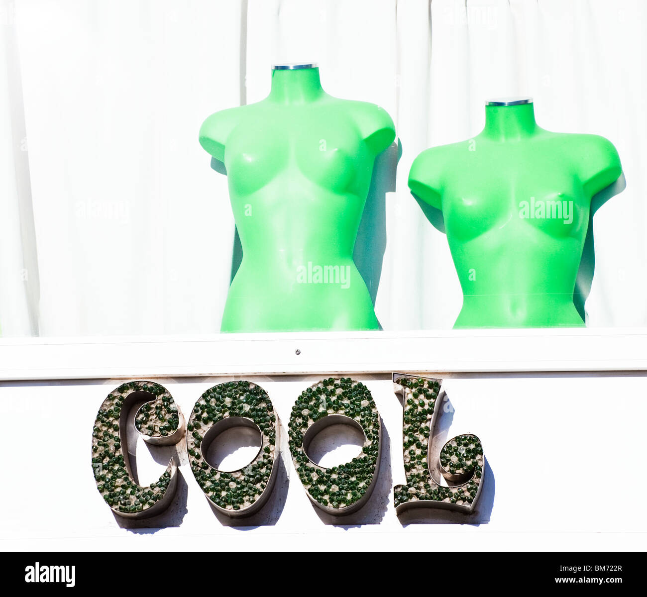 Malaga, Malaga Province, Costa del Sol, Spain. Clothing shop Cool with green mannequins. Stock Photo