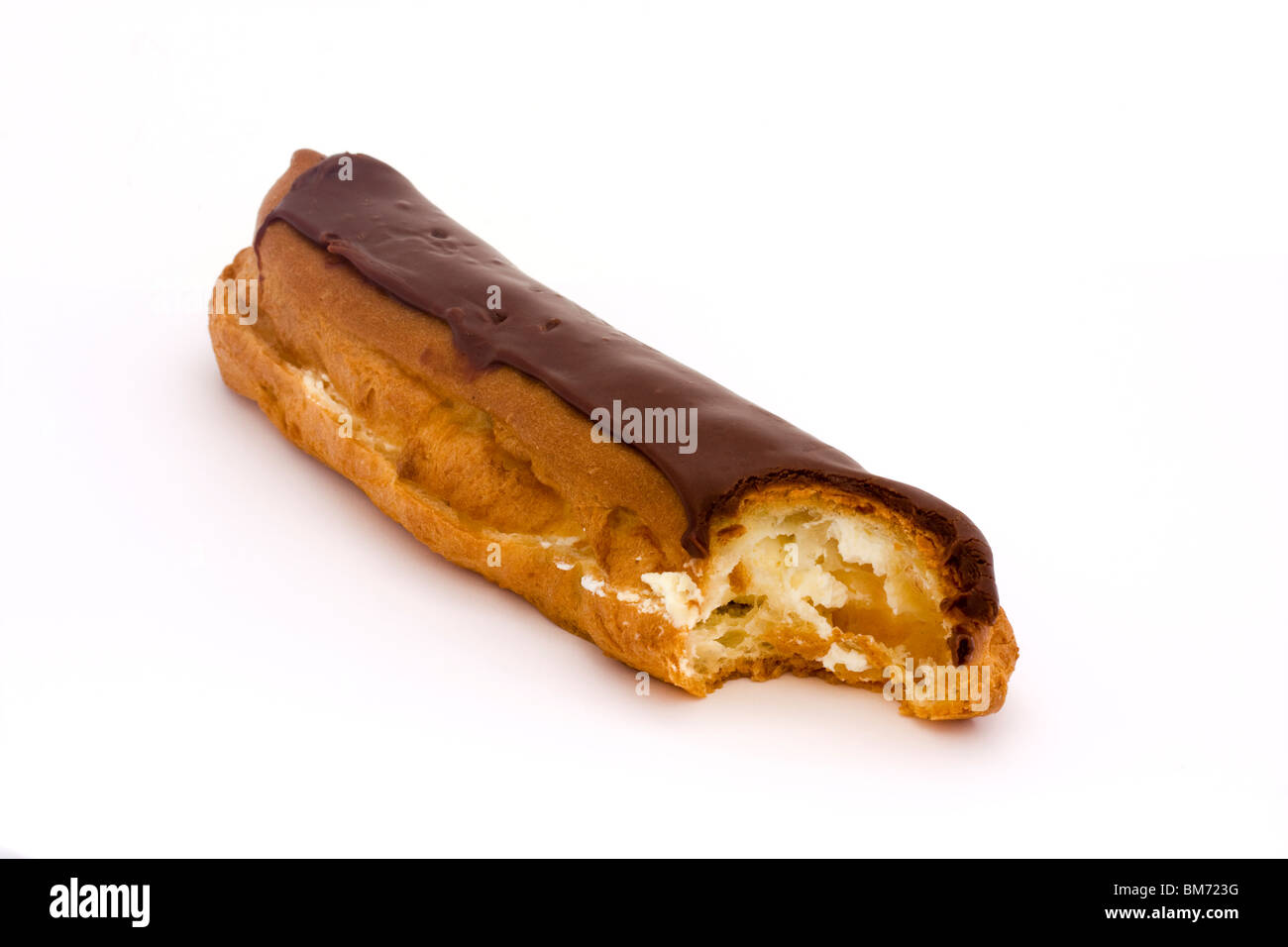 chcolate eclaire witha bite taken on a white background Stock Photo