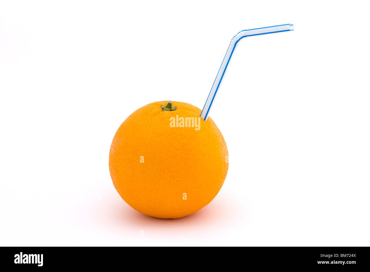 orange with straw on a white background Stock Photo