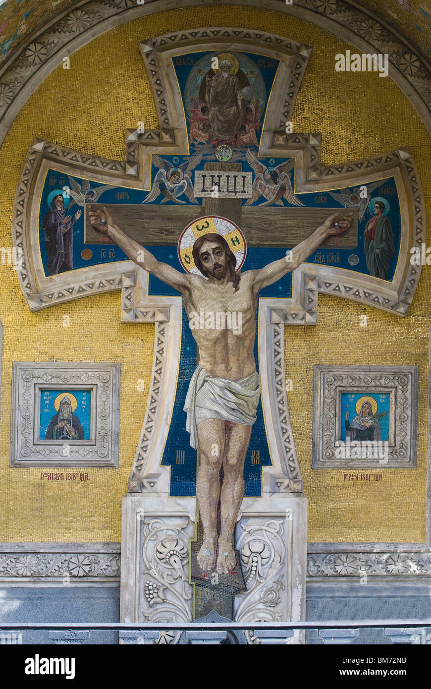 Jesus Christ on the cross. Mosaic orthodox icon on the facade of the famous cathedral of the Savior on Spilled Blood Stock Photo