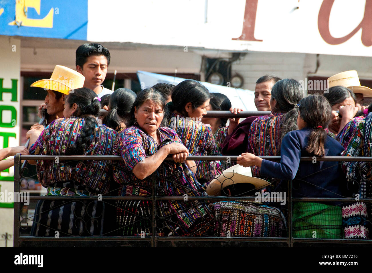 Native Indigenous Mayan People in a truck used for transporting people from a town to another town Panajachel Guatemala Stock Photo