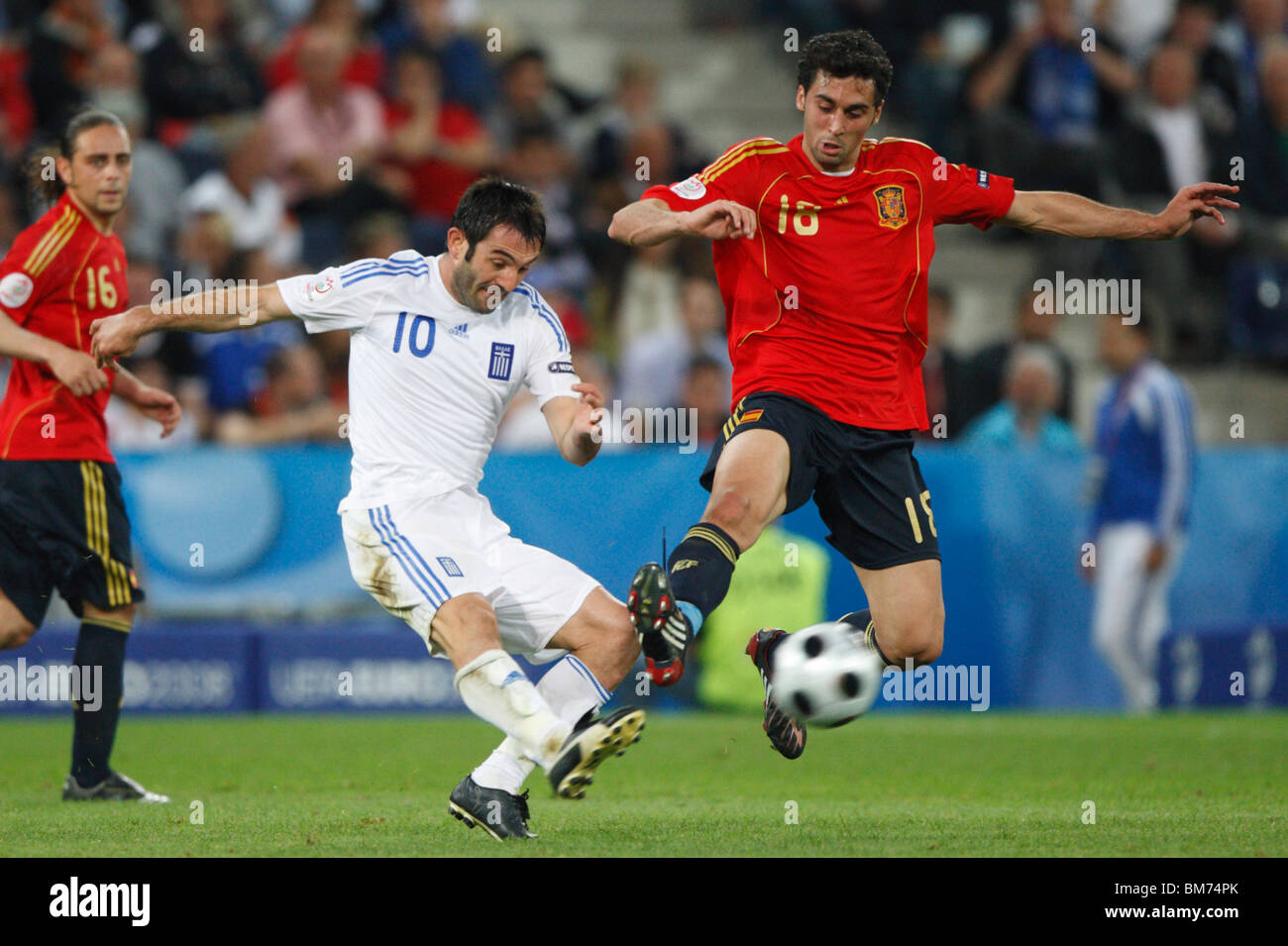 Alvaro Arbeloa of Spain (r) tries to block a kick from Giorgos Karagounis of Greece (l) during a UEFA Euro 2008 football match. Stock Photo