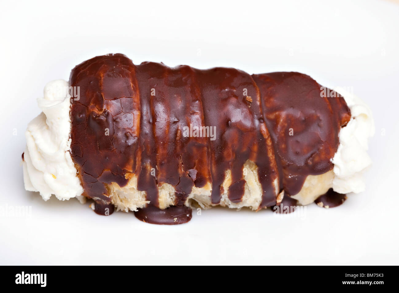 Roll with whipped cream and chocolate Stock Photo