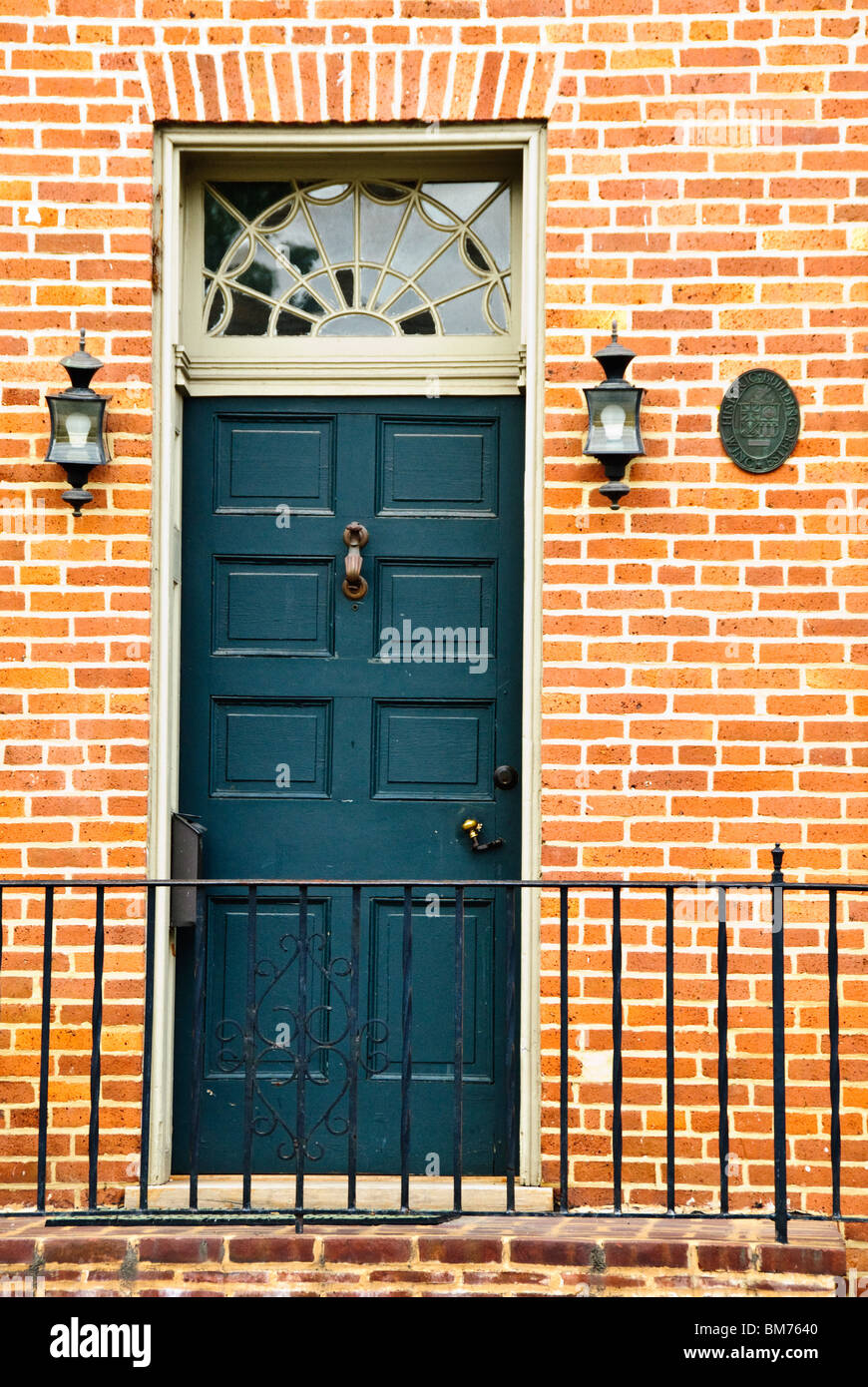 Grey front door brick wall hi-res stock photography and images - Alamy