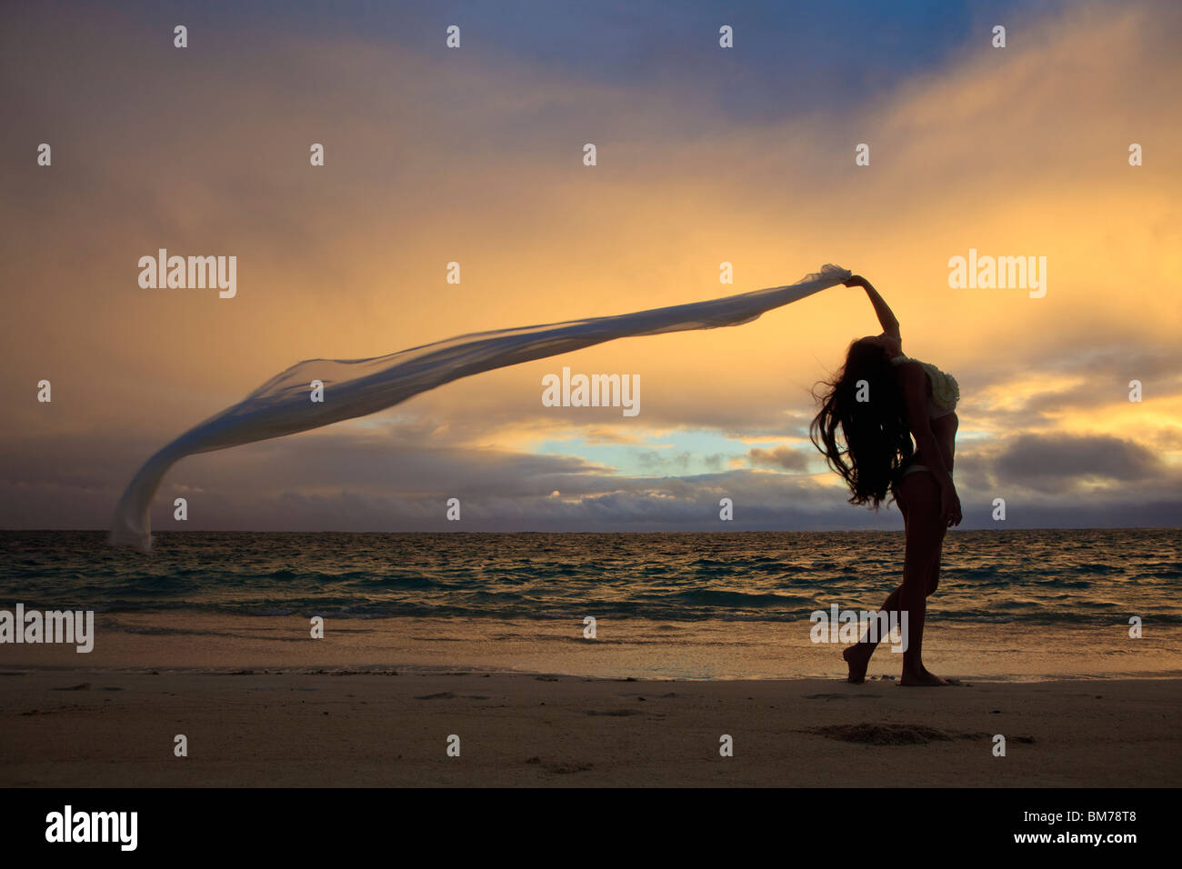 beautiful young woman on lanikai beach at sunrise Stock Photo