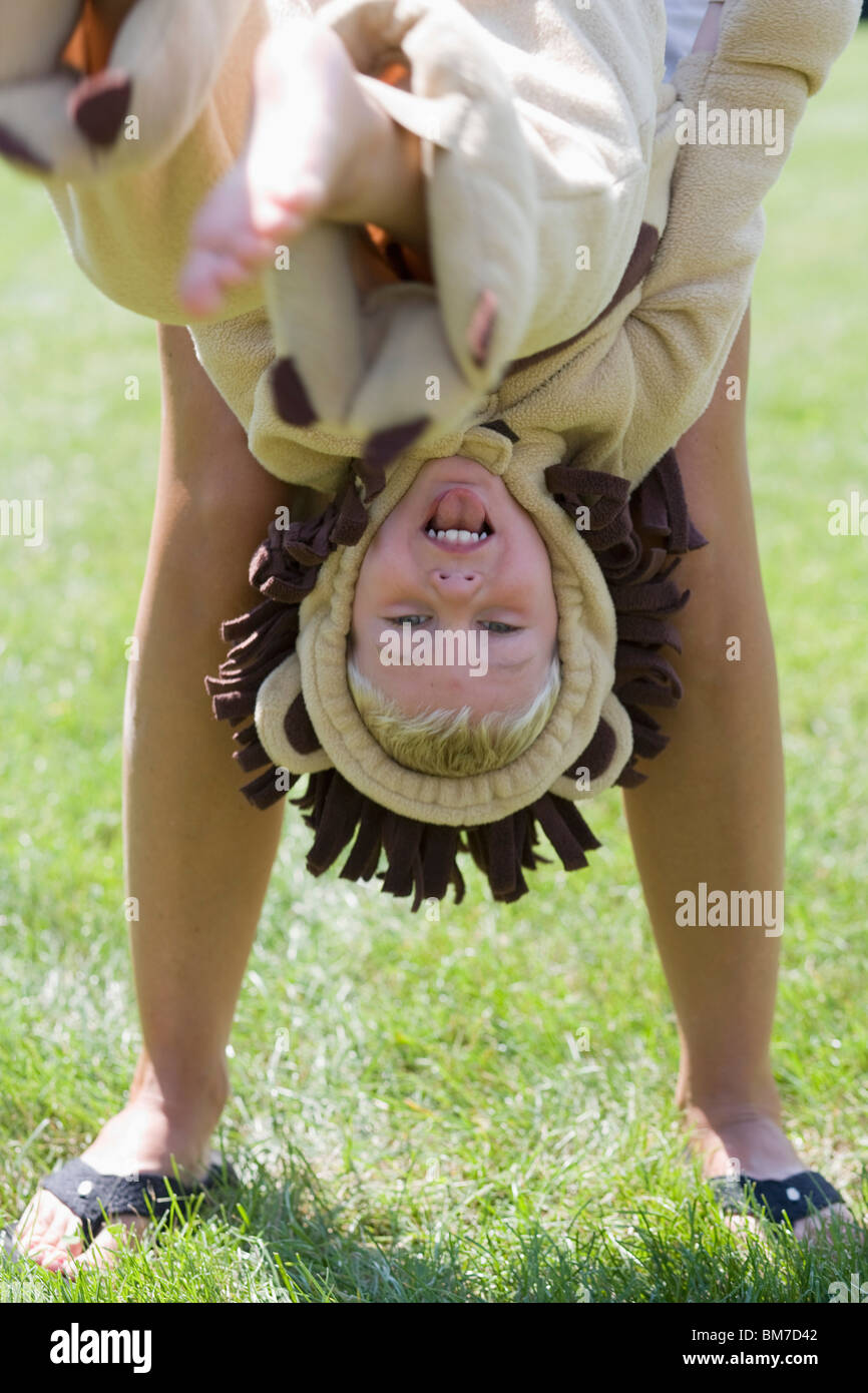 Child held upside down hires stock photography and images Alamy