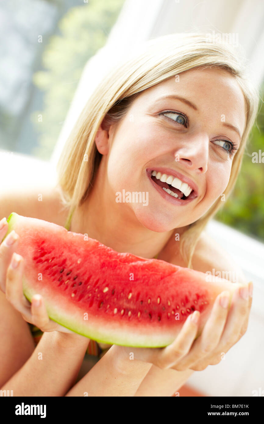 Girl eating Melon Stock Photo Alamy