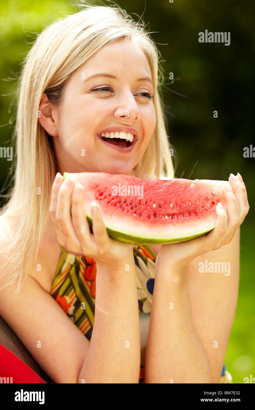 Girl eating Melon Stock Photo Alamy
